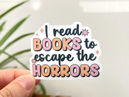 I Read Books to Escape the Horrors sticker